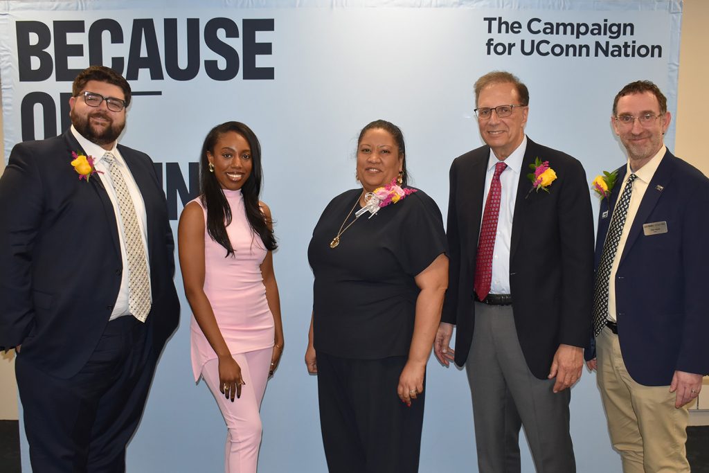 A group of CLAS Alumni Award Recipients pose with the dean during the 2026 award ceremony. 