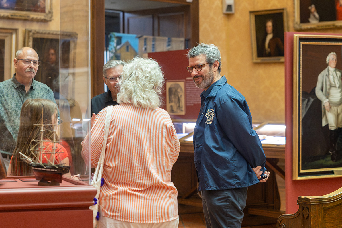 Connecticut State Historian talks with visitors of the Museum of Connecticut History.