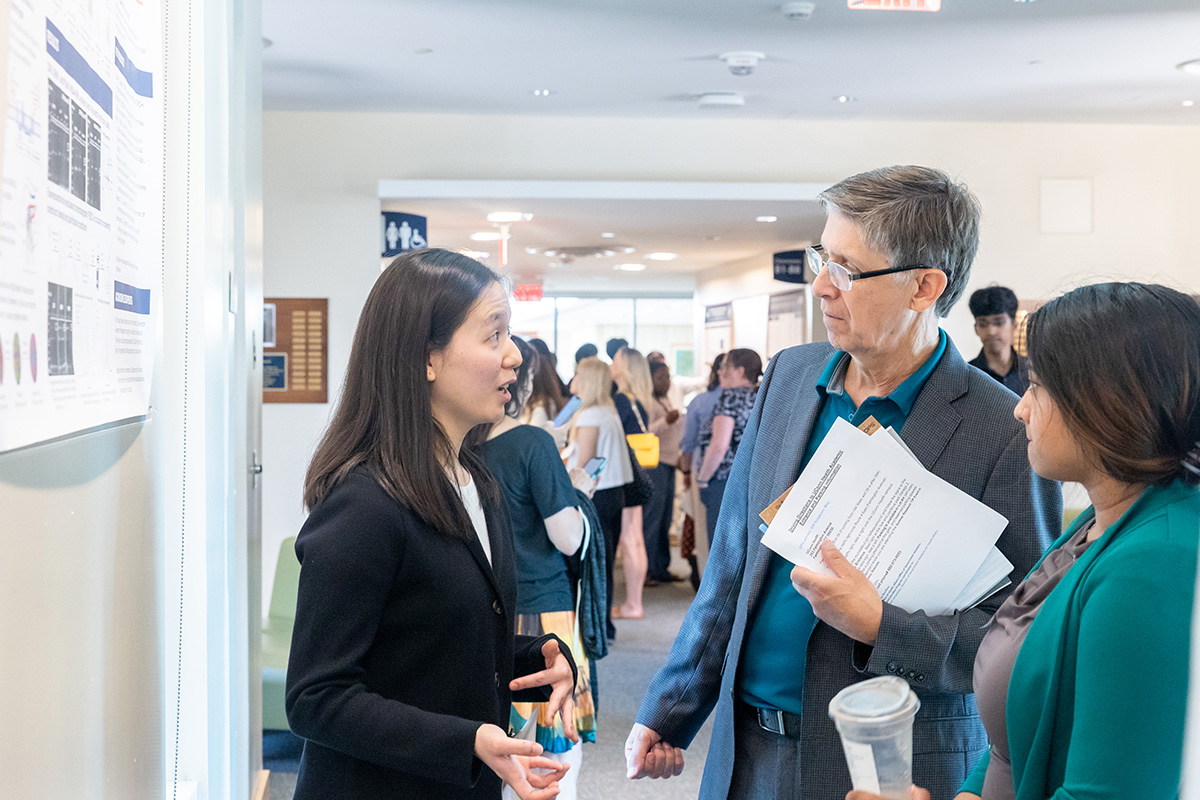 Connecticut Rep. Mike Demicco speaks with Ellie Lee ’28 (CLAS), one of his constituents presenting their projects during Summer Research Day.