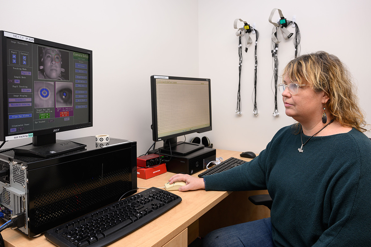 A researcher uses equipment at the Cognitive Sciences Shared Electrophysiology Resource Lab.