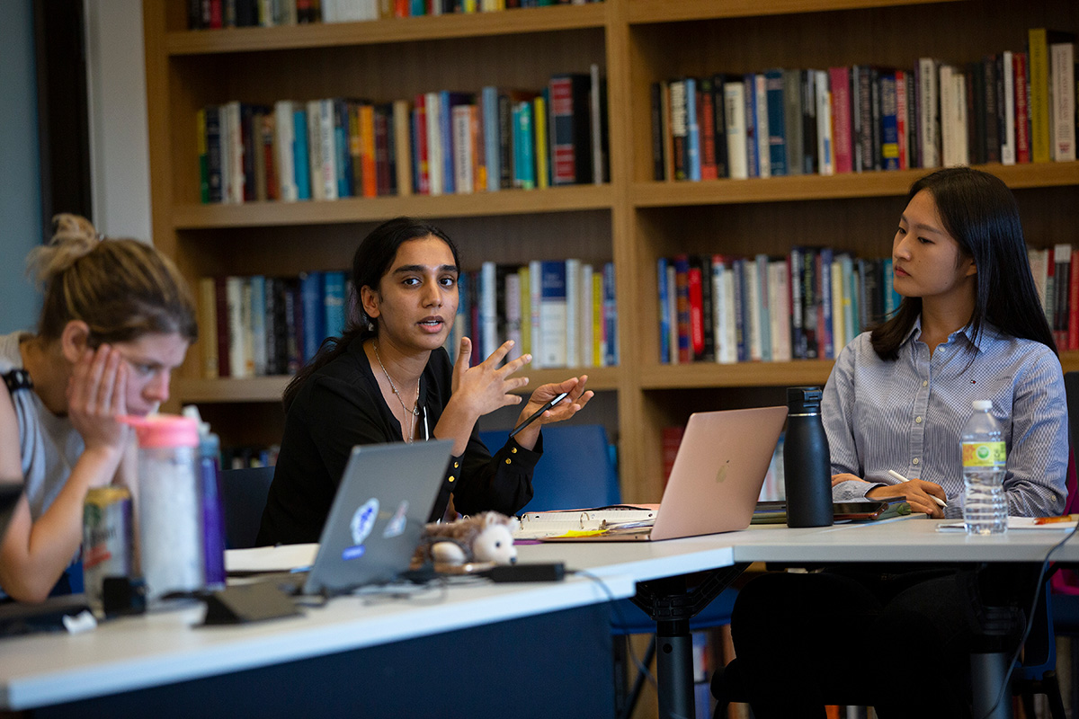 Students discuss a topic in a political science seminar course.