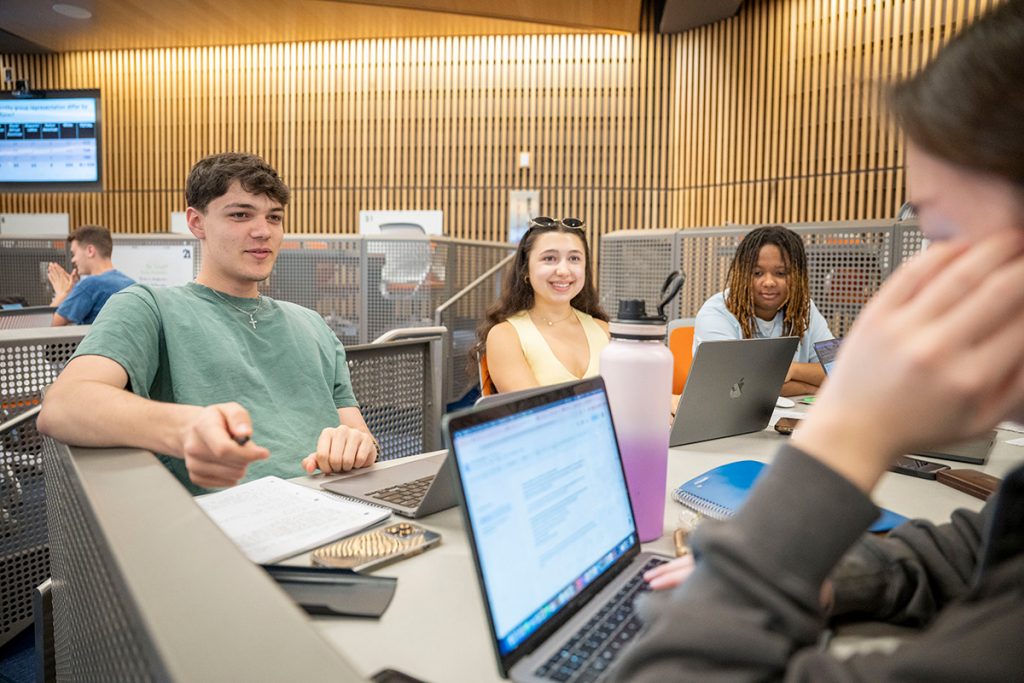 CLAS students working on a group project in class.