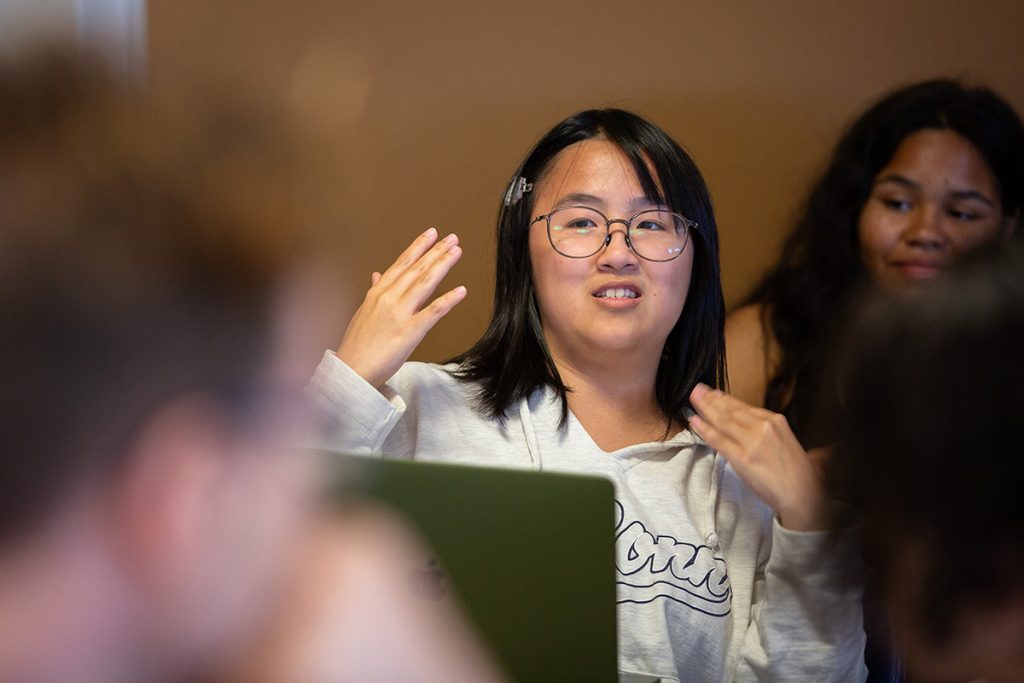Student gestures while answering a question in class.