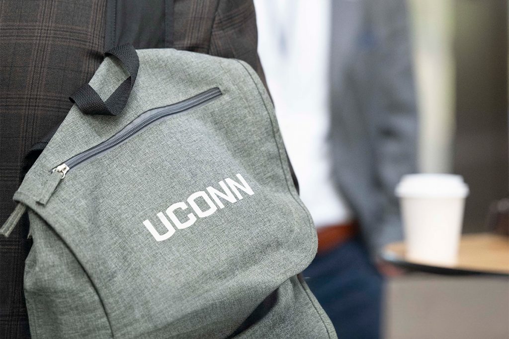 A closeup of a backpack reading "UConn."